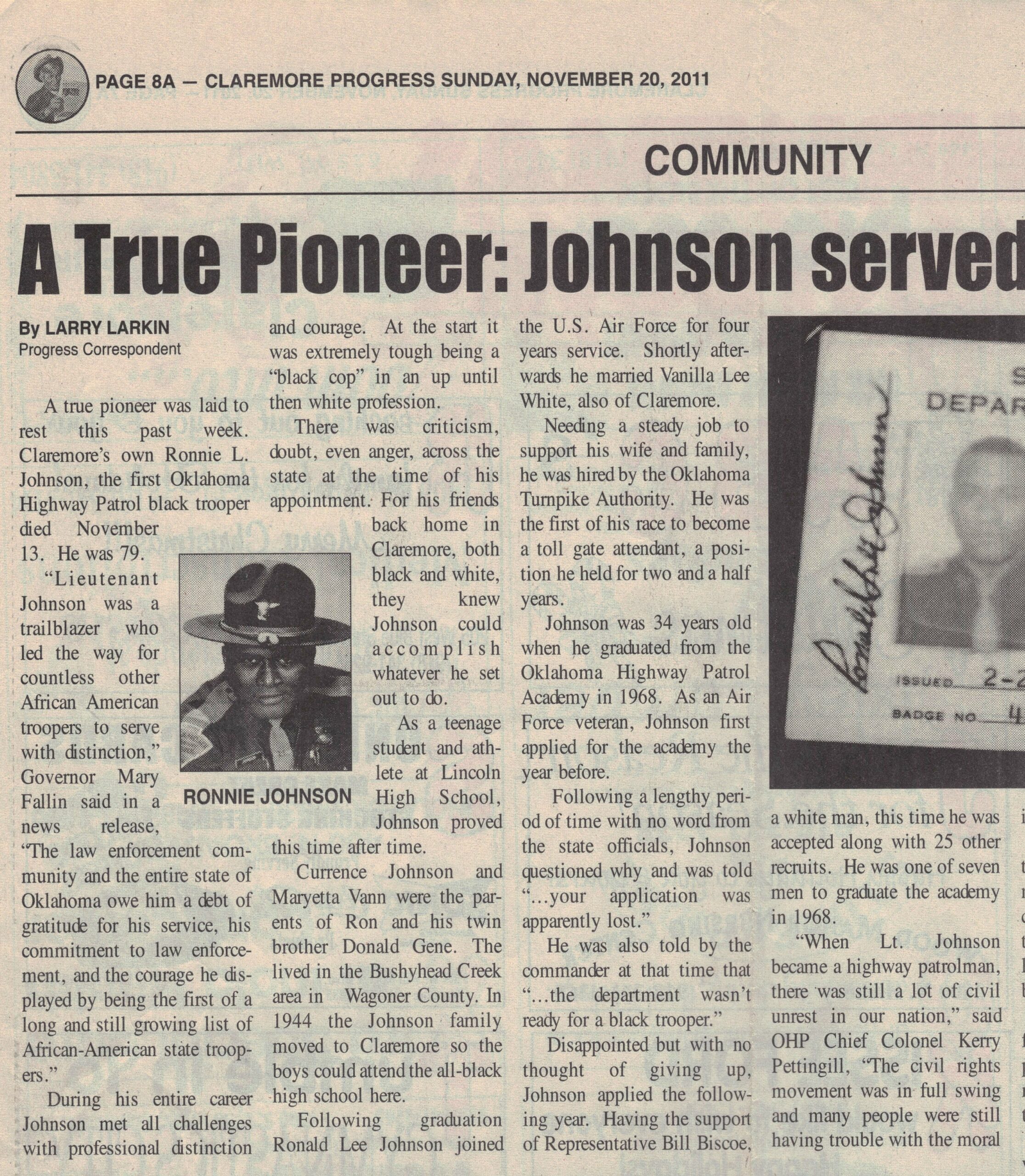 Four columns of article text with picture of Black highway patrolman in uniform under article title and newspaper header.